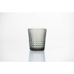 a clear glass cup sitting on top of a table