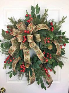 a christmas wreath hanging on the front door