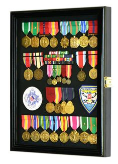 a display case with medals and badges in it