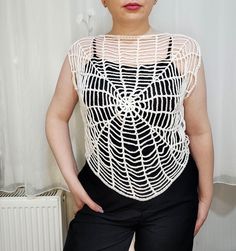 a woman standing in front of a radiator with her hands on her hips