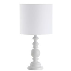 a white table lamp with a white shade