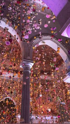 the ceiling is decorated with flowers and petals