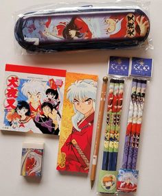 an assortment of stationery items including pencils, markers and pens