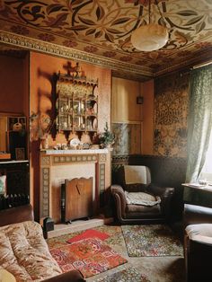 a living room filled with furniture and a fire place in the middle of a room