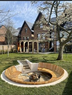 an outdoor seating area in front of a large house