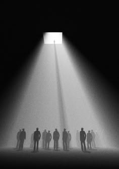 a group of people standing in the middle of a room with a light coming from it