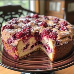 a cake that has been cut into pieces and is sitting on a glass platter