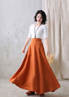 "You'll feel ultra chic and modern wearing the A Line skirt throughout the year, the long skirt will be a prefect on for your summer autumn. DETAIL * More colors available https://etsy.me/3ifY3Py * 100% pure linen * Two side pockets * Right Hidden Zipper closure * Back elastic waistband * Maxi linen skirt, long linen skirt, Plus size Skirt * Ankle length effect * Perfect for Summer, spring and Autumn * Machine Washable in Warm/Cold Water/Do not bleach /Mid-iron /Hang Dry *The model is 170 cm (5′ Elegant Orange Skirt For Spring, Fitted Orange Midi Skirt, Chic Stretch Orange Skirt, Orange Relaxed Flared Maxi Skirt, Orange Relaxed Full Skirt, Flowy Flared Orange Skirt, Relaxed Orange Maxi Skirt, Orange Flowy Lined Maxi Skirt, Orange Flared Maxi Skirt Lined