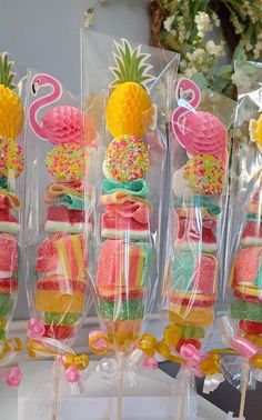 some lollipops are wrapped in plastic and have pineapples on them