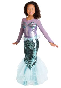 PRICES MAY VARY. Size: X-Small Enchanting Mermaid Transformation: Let your child dive into the world of fantasy with this stunning Pretty Purple Mermaid Costume. Easy Dressing: Features a convenient hook & loop fastener at the center back for hassle-free costume changes. Quality Materials: Crafted with 100% polyester, mesh yoke & sleeves, and sequined seashells for a truly captivating look. Shimmering Mermaid Elegance: The skirt front is adorned with dazzling sequins, making your child shine lik Girls Mermaid Costume, Princess Dress Fairytale, Fairy Tale Costumes, Mermaid Kids, Black Halloween Dress, Mermaid Outfit, Purple Mermaid, Garden Party Dress, Princesa Disney