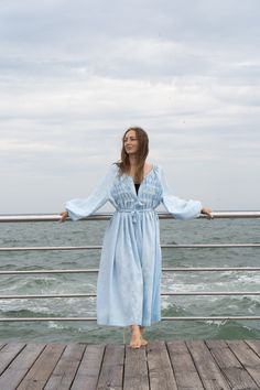 Blue Maxi Dress,Linen blue long dress,Puff sleeves dress,Maternity dress,Oversized dress,Linen Looose dress,Plus size dress Maxi linen  Dress Spring-summer dress with long  sleeves. Dress below the knee, flared. Round neckline with decorative pleats at the bodice. Long and wide sleeves gathered at the cuff. The dress fastens with buttons. Ties at the waist. Dress without lining.  Model height 170cm and S Sleeve length: 67cm  Product length from the shoulder: 94cm, 110cm , 130 cm.  - Made from 100% natural linen. Certified by OECO-TEX  -Details: The fabric is soft, as the product is pre-washed to avoid shrinkage in the future. - Care instructions: It is desirable to wash the product in cold water (not higher than 40 degrees), and also wash the product in a delicate mode. Please use mild det Long Sleeve Beach Dress With Gathered Sleeves, Long Sleeve Dress With Gathered Sleeves For Beach, Blue Long Sleeve Puff Sleeve Dress For Brunch, Beach Dress With Long Gathered Sleeves, Blue Long Sleeve Midi Dress With Pleated Sleeves, Light Blue Long Sleeve Midi Dress For Daywear, Blue Bishop Sleeve Dress With Elastic Sleeves, Beach Maxi Dress With Puff And Gathered Sleeves, Blue Smocked Midi Dress For Daywear