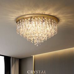 a chandelier hanging from the ceiling in a living room