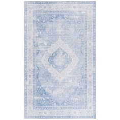 a blue and white rug with an ornate design on the bottom, in front of a white background