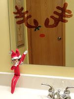 an elf is standing in front of a mirror with his arms up and legs spread out