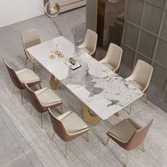 a marble dining table with beige chairs around it and a white rug on the floor