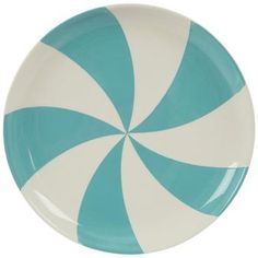 a blue and white plate with a striped design