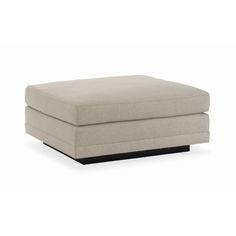 the footstool is shown in beige fabric