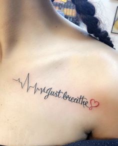 a woman with a heartbeat tattoo on her chest