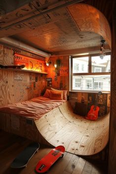 a skateboard is laying on the floor in front of a room with wooden walls