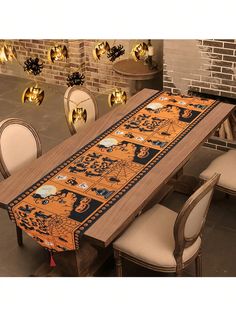 a long table with chairs around it in front of a brick wall and gold decorations