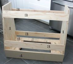 a kitchen counter with measurements for the top and bottom drawers on it, next to a dishwasher