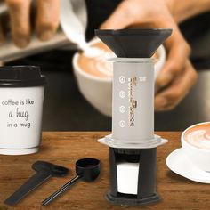 a coffee maker sitting on top of a wooden table