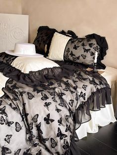 black and white bedding with butterflies on it