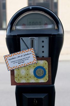 a parking meter with a card attached to it