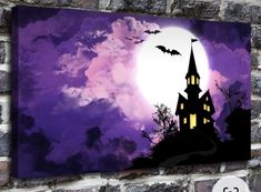 an image of a castle with bats flying in the sky on a purple and black background