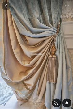 a curtain with tassels hanging from it