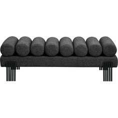 a black and white photo of a couch with six pillows on it's back