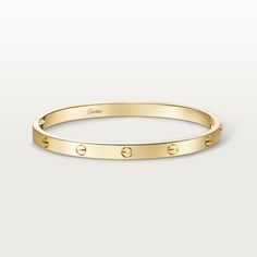 Cartier - LOVE bracelet, medium model - Bracelet Woman  - LOVE bracelet, medium model, 18K yellow gold (750/1000), closure system with functional screw and hinge. Comes with a screwdriver. Width 4.8mm. Created in New York in 1969, the LOVE bracelet is a jewelry design icon: a close fitting, oval bracelet composed of two rigid arcs, which is worn on the wrist and removed using a special screwdriver. Cartier continues the story of the original LOVE bracelet with a version featuring a hinge and an intermediate width, between the small and classic models. Same design, same story: a timeless – yet slightly slimmer – creation which is fastened using a screwdriver. On this model, the closing system consists of a functional screw on one side of the bracelet and a hinge on the other, enabling it to Cartier Lock Bracelet, Cartier Screw Bracelet, Cartier Gold Bracelet, Classy Gold Jewelry, Gold Cartier Bracelet, Gold Designer Bracelet, Cartier Band, Rich Husband, Oval Bracelet