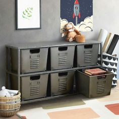 a toy monkey sitting on top of a shelf next to some bins and baskets