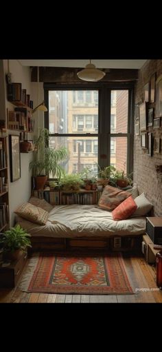 a living room filled with lots of furniture and bookshelves next to a window