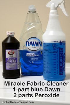 two bottles of fabric cleaner, one blue dawn and the other 2 parts peroxide