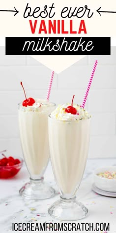 two glasses filled with vanilla milkshake and topped with whipped cream, cherries and sprinkles