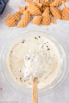 a bowl filled with cream and chocolate chips