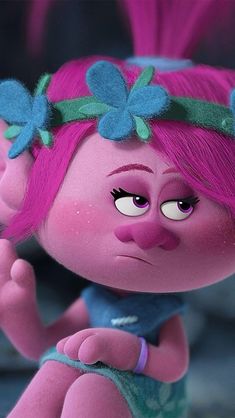 a close up of a cartoon character with pink hair