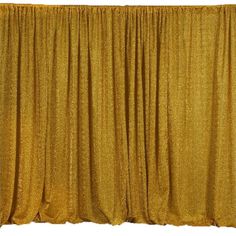 an image of a gold colored curtain with wood floor and wall in the foreground