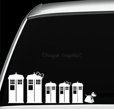 the back window of a car with an image of three tardishes on it