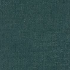 a dark green fabric textured with small dots and lines, as well as the background