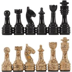 a set of chess pieces sitting next to each other on top of a white surface