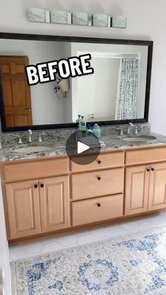 a bathroom with two sinks and a large mirror on the wall above it that says before