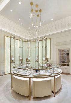 the inside of a jewelry store with circular display cases