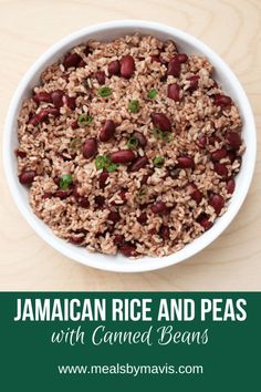 jamaican rice and peas with canned beans in a white bowl on a wooden table top