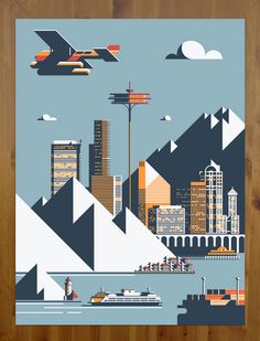 a poster with an image of a city in the middle and mountains behind it, on a wooden surface