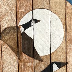 an image of a bird painted on wood