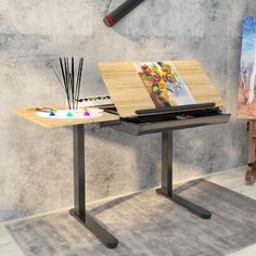 an artist's easel with paint and brushes on it