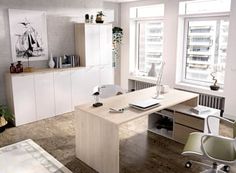 an office with white walls and wooden floors