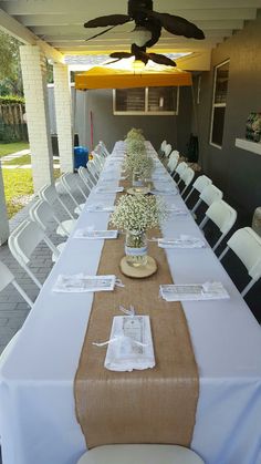 a long table is set with place settings